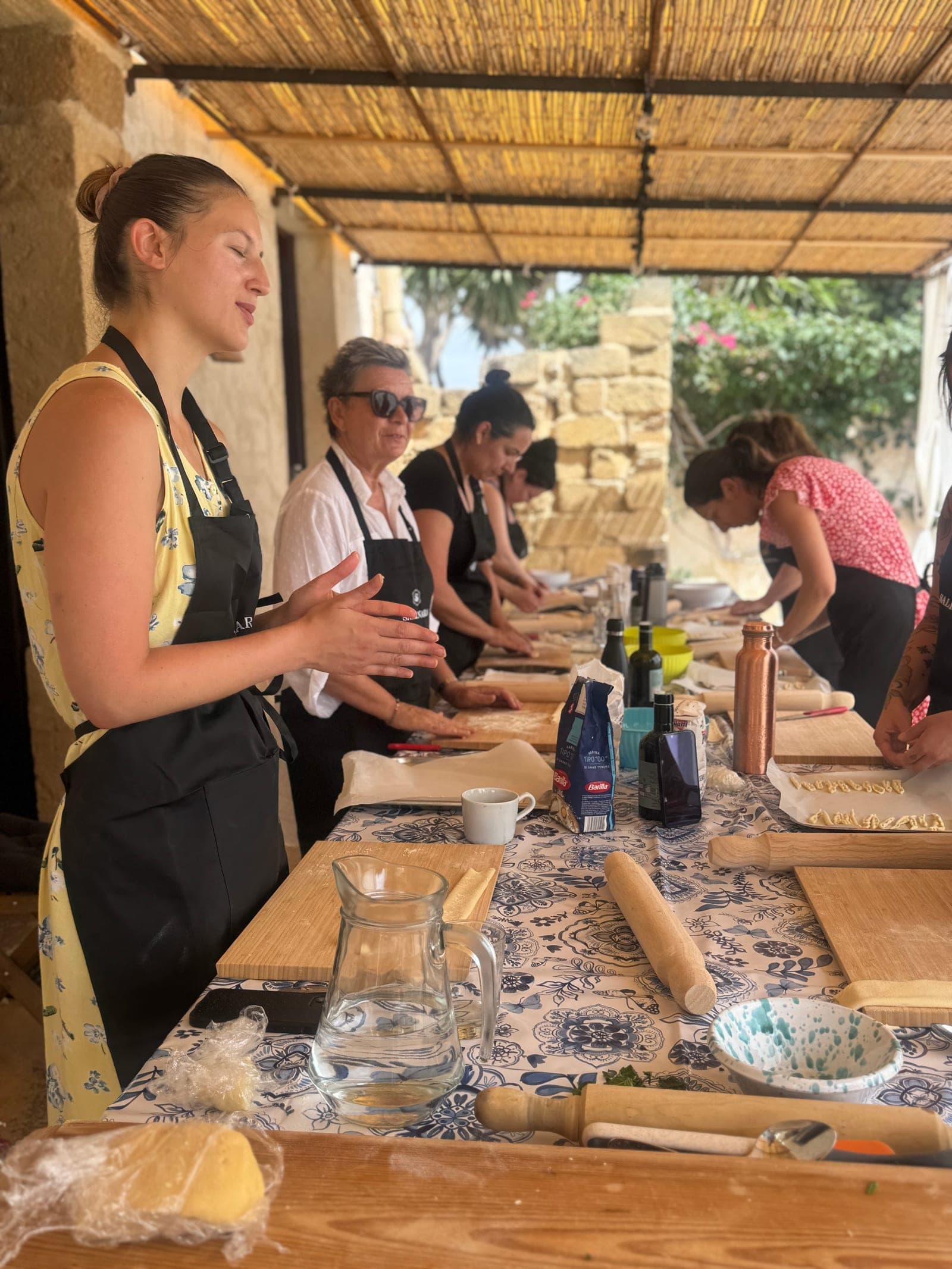 Guests preparing food together during a Salinara cooking class