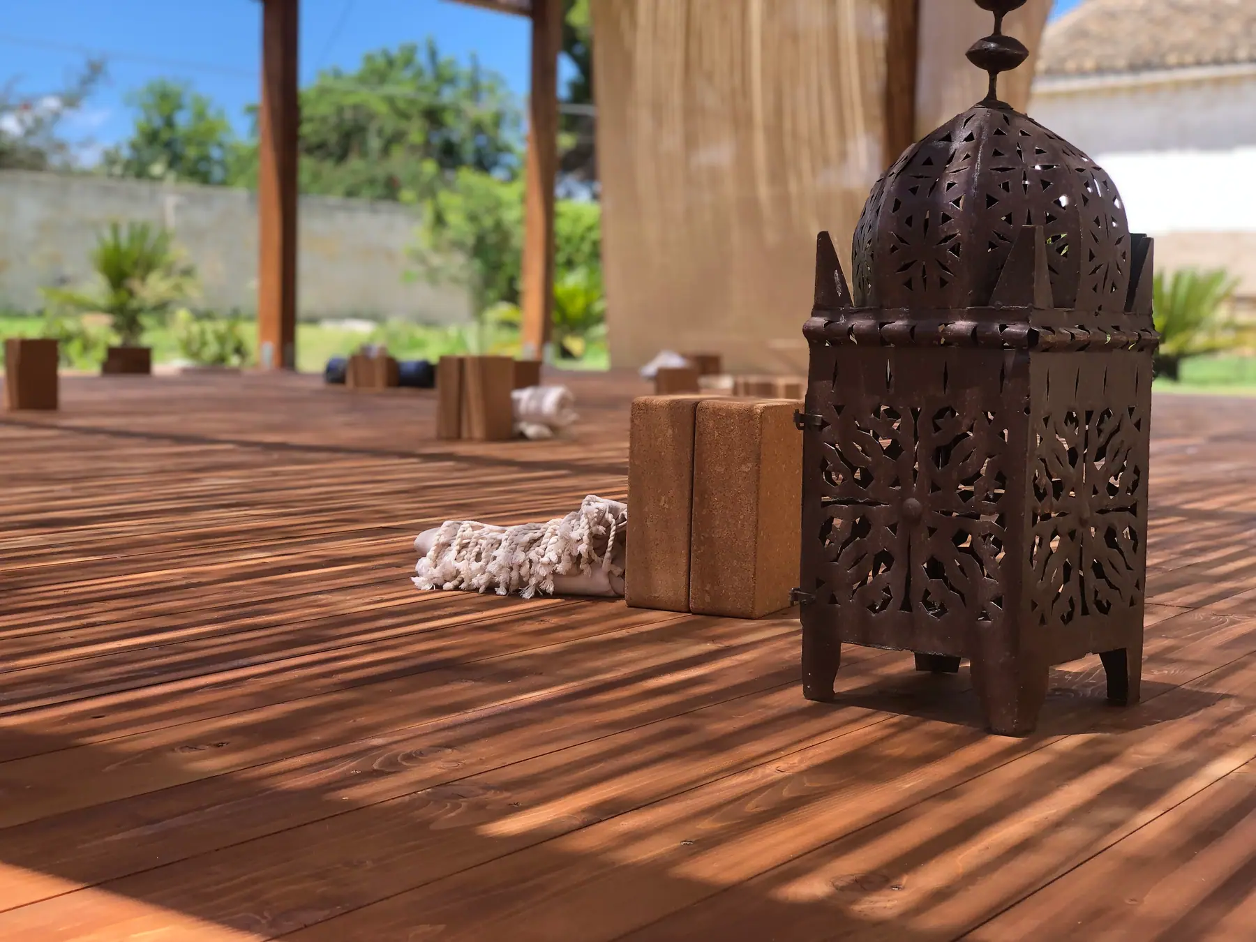 Yoga props and lantern on the Salinara wooden practice deck